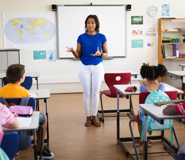 A teacher stands in front of her special education classroom